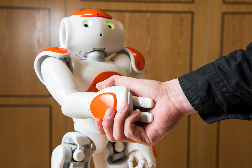 Photo: Shaking Hands And Cooperation In Tele-Present Human-Robot Negotiation