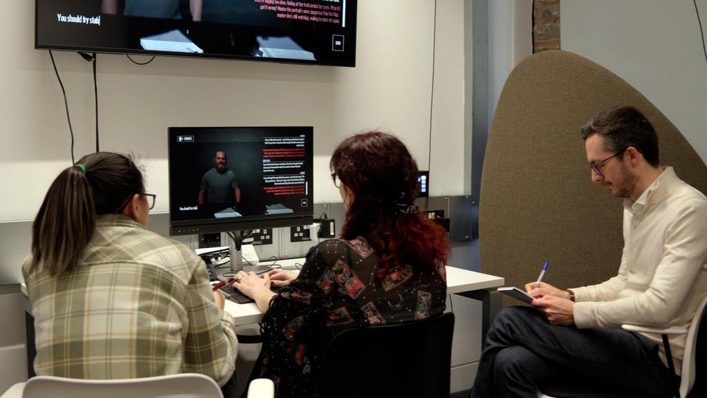 Photo: A participants plays "Blood Will Out" under the watchful eye of Dr Richard Cole.