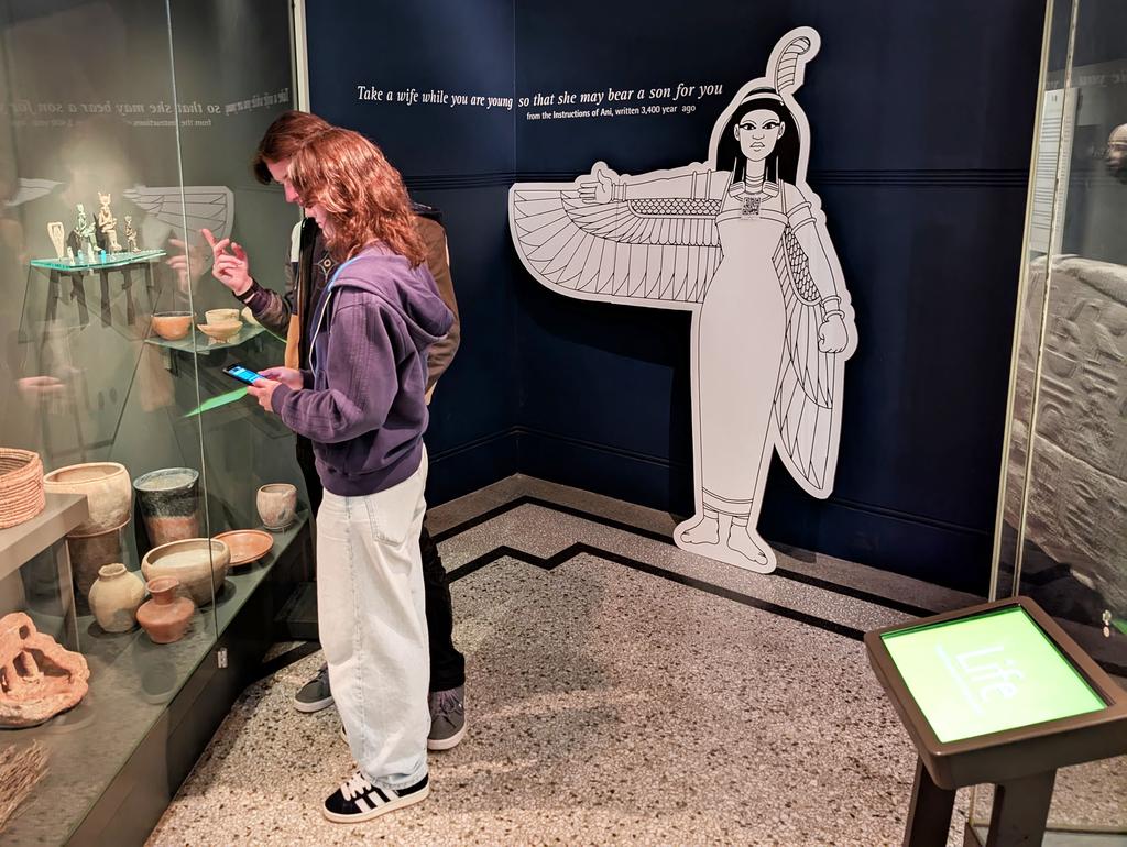 Photo: Participants exploring the Egypt exhibition at Bristol Museum, under the guidance of the gods.